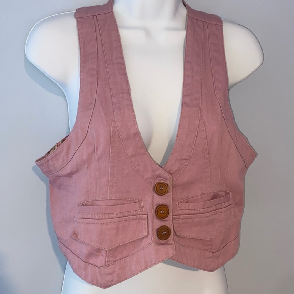 Vest with buttons, pink with floral accents on inside. Pockets